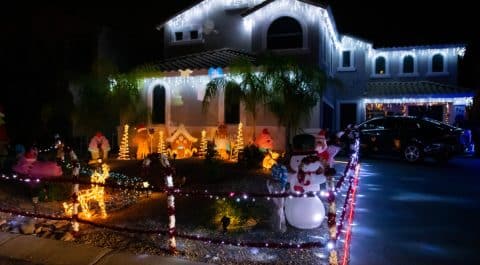 Queen Creek, AZ, USA - Dec 23, 2021: Houses full of light show and decorations